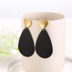 Boucles d'Oreilles Stylisées Noir et Or larme noir