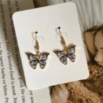 Boucles d'Oreilles Fantaisie Symbole Papillon blanc