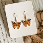 Boucles d'Oreilles Fantaisie Symbole Papillon orange