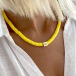 Collier Surfeur Disques Colorés Pendentif Œil jaune