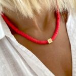 Collier Surfeur Disques Colorés Pendentif Œil rouge